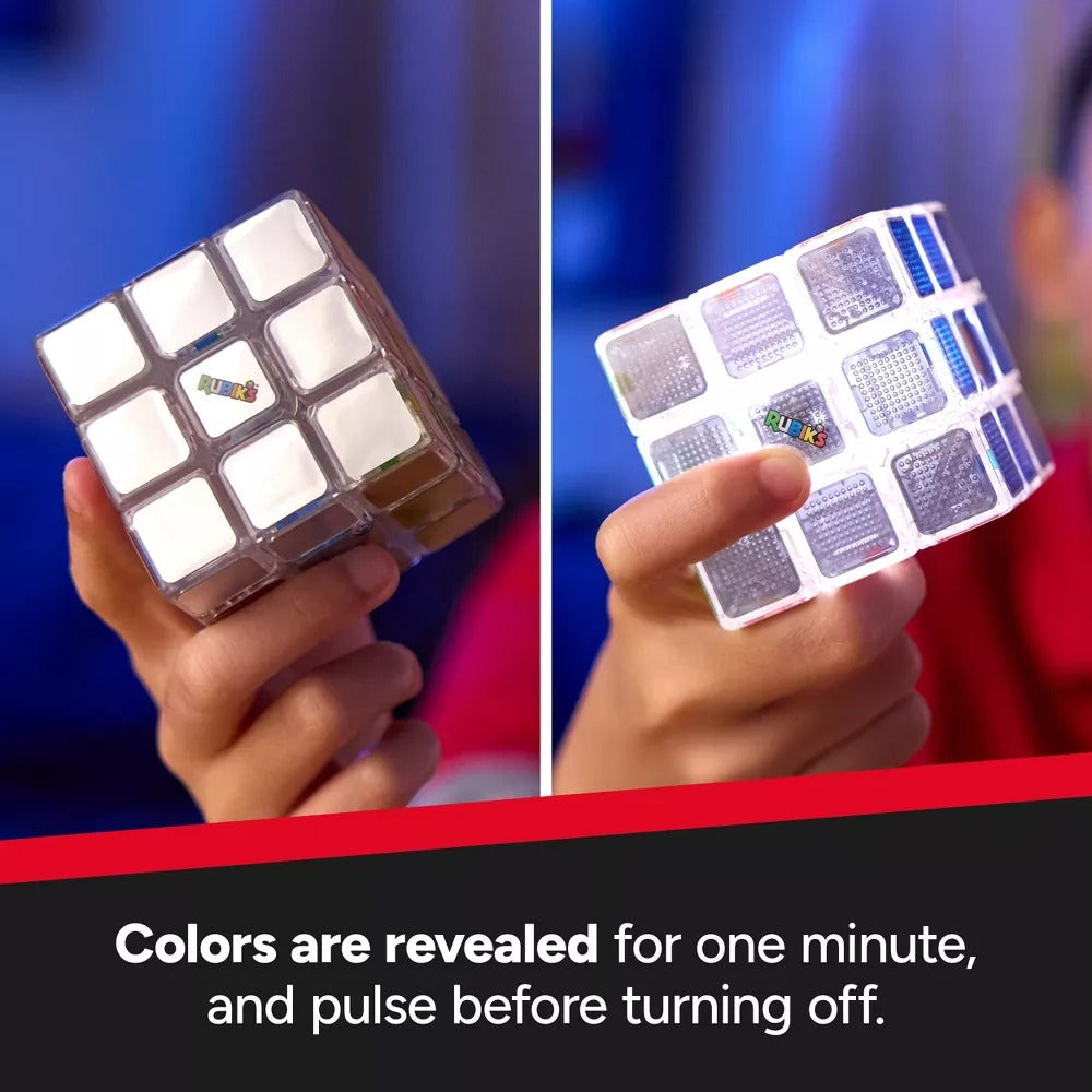 Split image of a Rubik's Cube held by a hand, left shows reflective white squares, right reveals blue & patterned colours