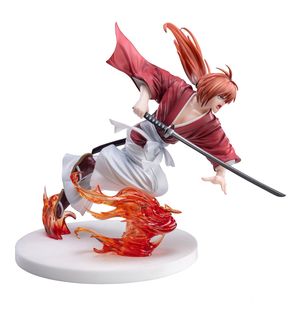 Kenshin Himura anime figure in red kimono and hakama, dynamically wielding a katana, with fiery effects on a white base