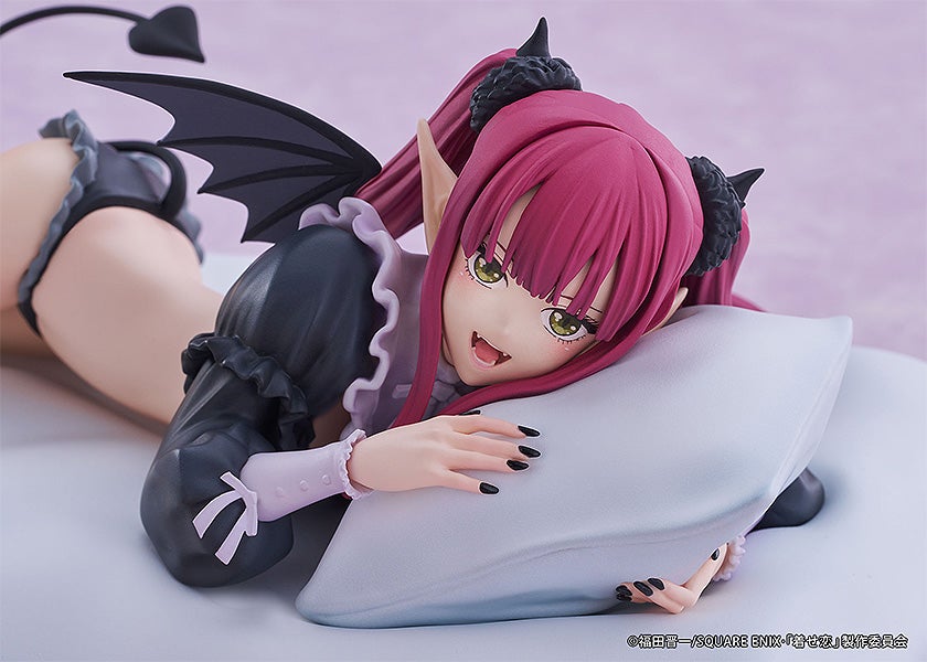 Anime figure of Marin Kitagawa from My Dress-Up Darling in a devil outfit lying on a pillow