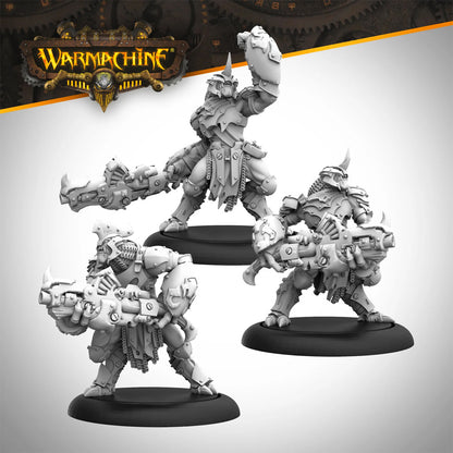 Three unpainted Warmachine armored figures with large tech weapons in dynamic combat poses