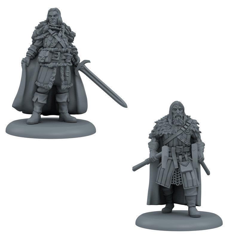 Two grey, unpainted fantasy miniatures: a swordsman in fur armor and a bearded man wielding two axes