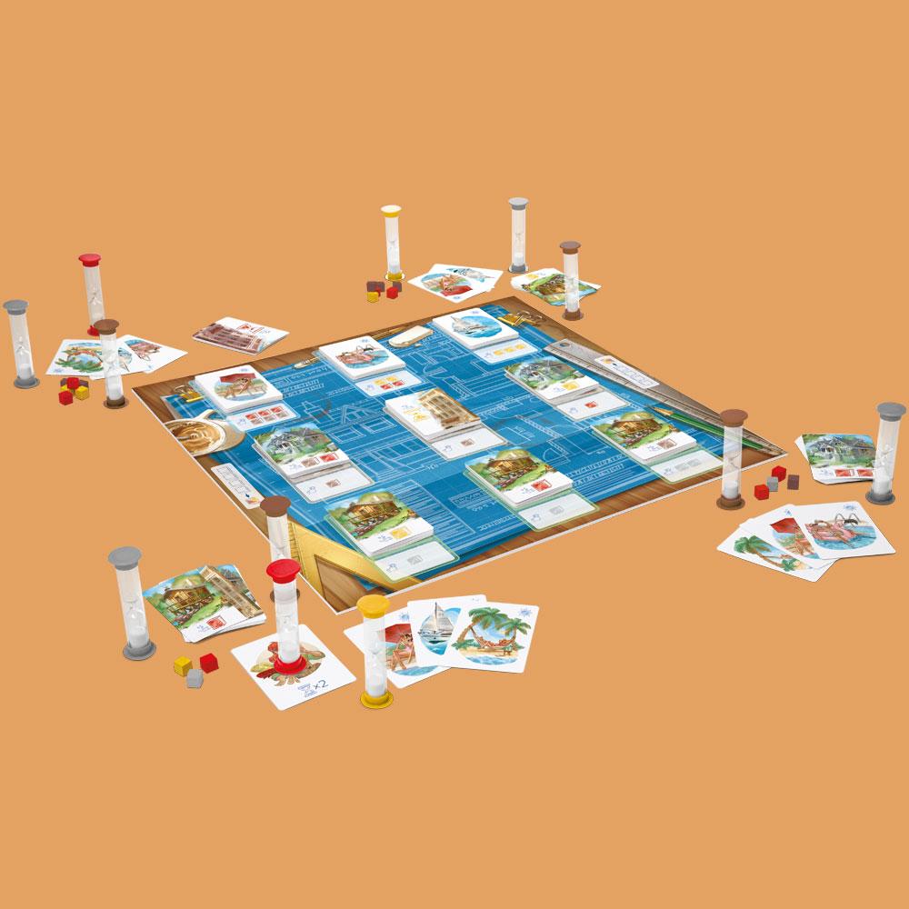 Board game setup with blue blueprint-style mat cards hourglass timers and red yellow and grey dice