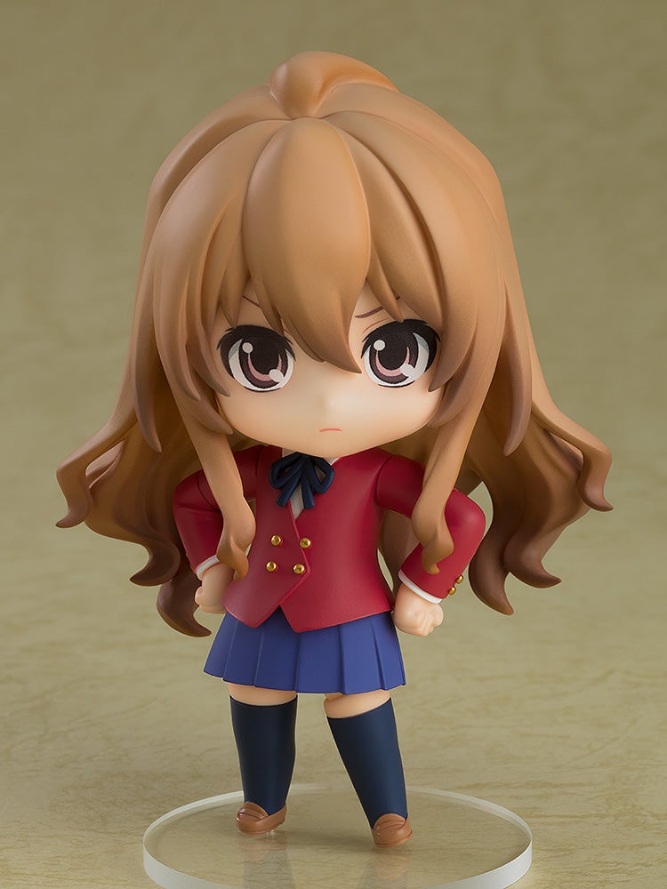 Nendoroid Taiga Aisaka figure in school uniform with red jacket and blue skirt on color background on base