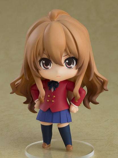 Nendoroid Taiga Aisaka figure in school uniform with red jacket and blue skirt on color background on base