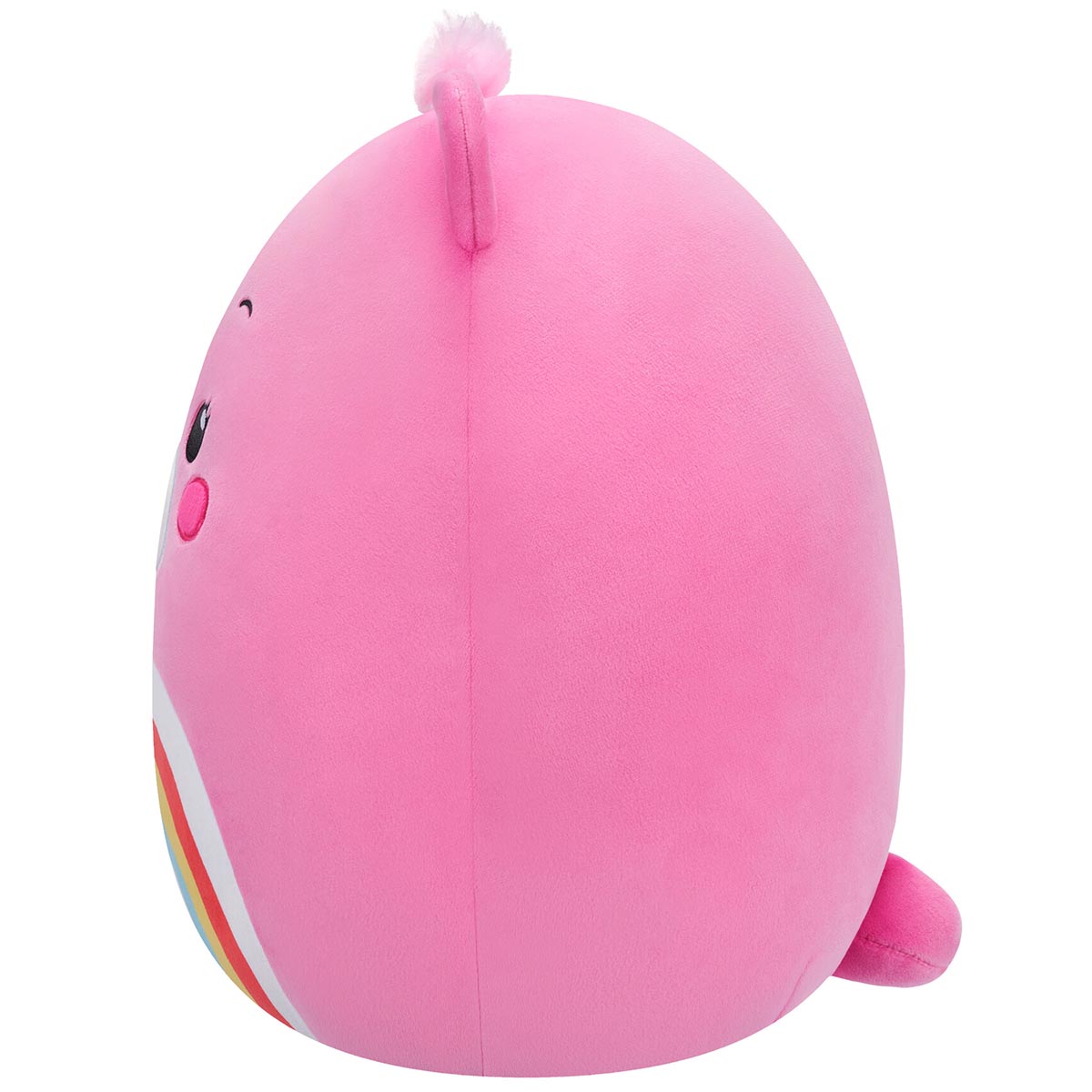 The 10-inch pink Squishmallow Care Bear plush is shown in profile, highlighting its round form, small ear tuft, and partial rainbow belly detail