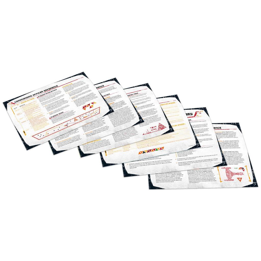 Fanned out white game reference sheets, showing text, diagrams, and distressed black borders