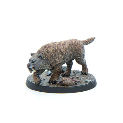 Miniature brown saber-toothed cat with prominent fangs, feeding on a kill on a rocky base