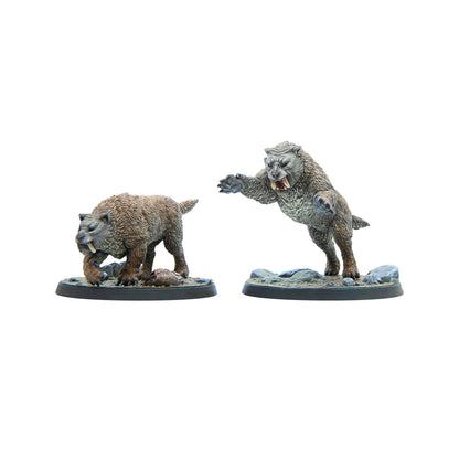 Two saber-toothed cat miniatures - one crouches, biting prey; the other stands on hind legs, roaring with raised claws