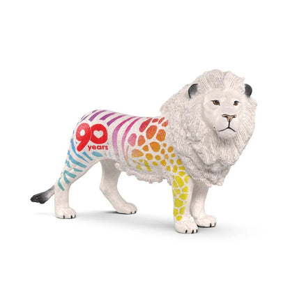 Rainbow-patterned white lion figurine with "90 years" text on its side, standing