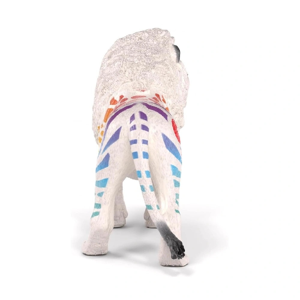 White lion figurine with colorful painted patterns on its back and tail, viewed from behind