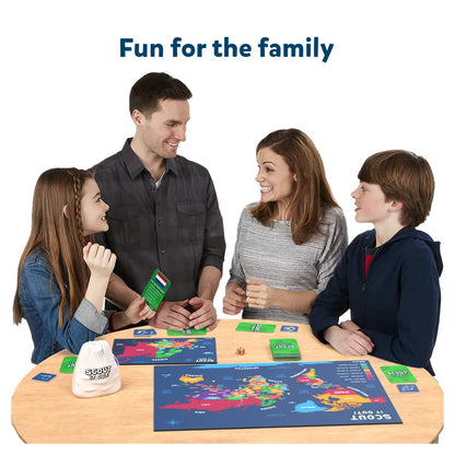 Smiling family of four playing a geography board game with a world map and cards