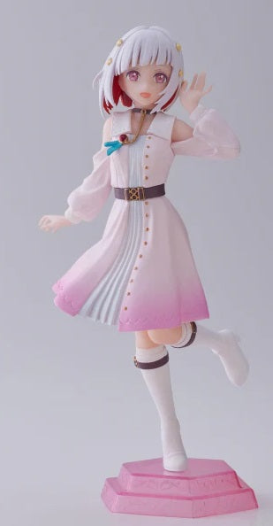 Tsuzuri Yugiri in idol outfit sitting at the edge of a platform with joyful expression