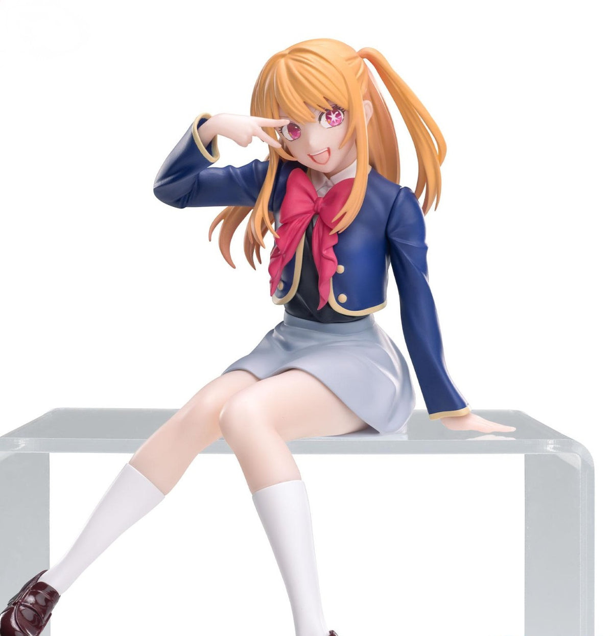 Ruby Hoshino figure from Oshi no Ko, seated in uniform, smiling gently with one hand raised