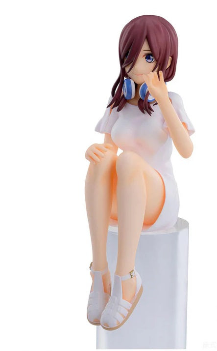 Miku Nakano figure in school uniform sitting on a bench with legs crossed