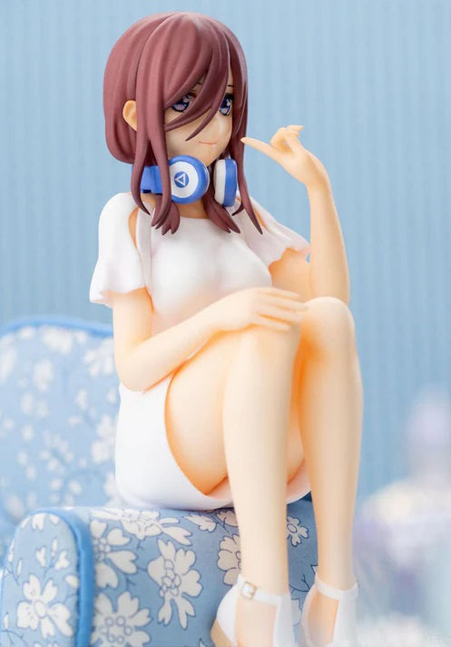 Rear view of Miku Nakano figure sitting on a bench, showing hair and uniform details
