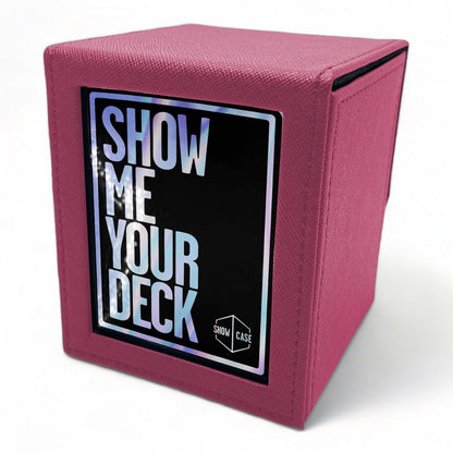 Pink textured trading card deck box with holographic 'SHOW ME YOUR DECK' text on a front label and 'SHOW CASE' logo