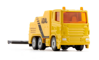 Yellow ADAC toy recovery truck with orange emergency lights, on a white background