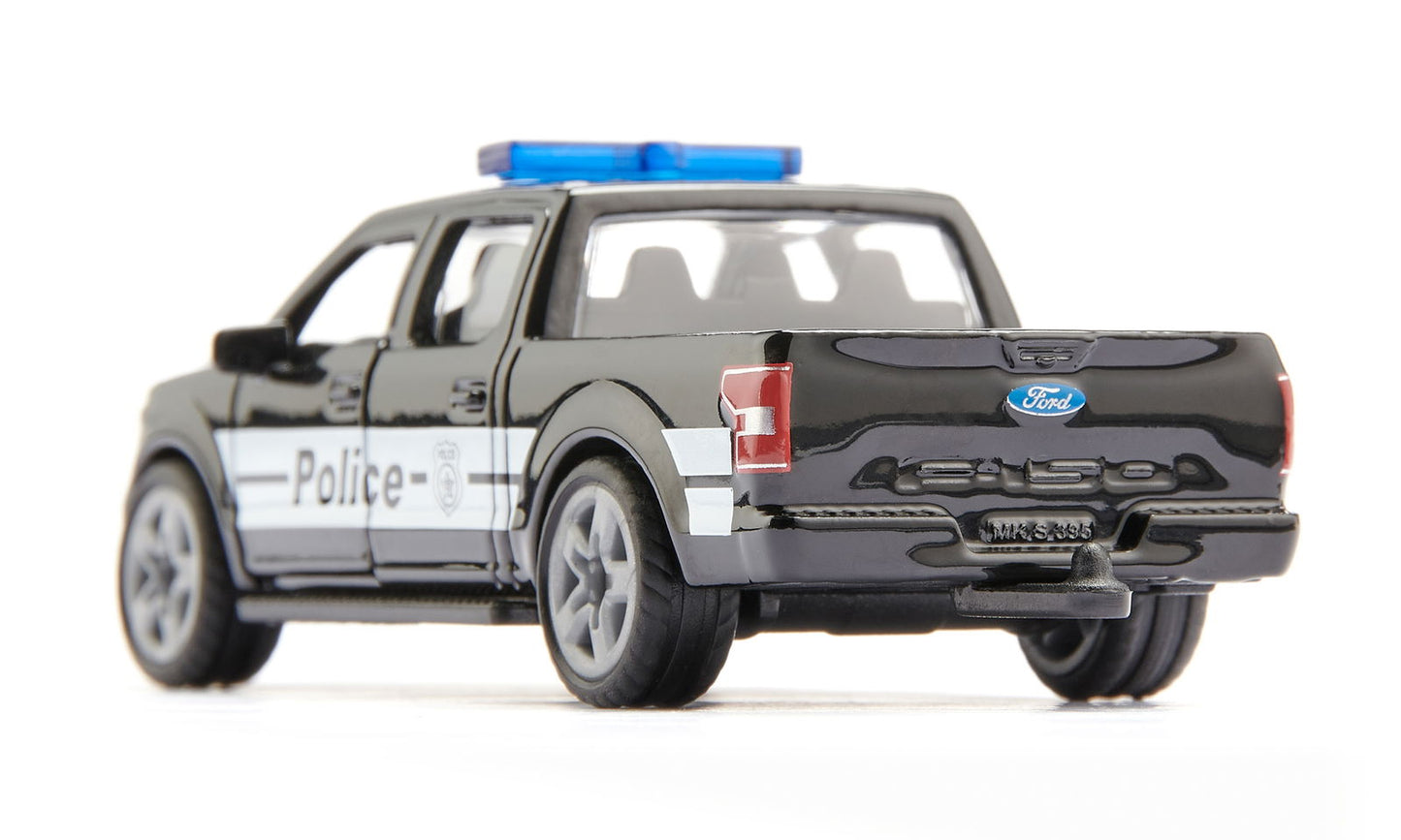 Black die-cast Siku Ford F-150 US police truck toy with a blue light bar, viewed from the rear