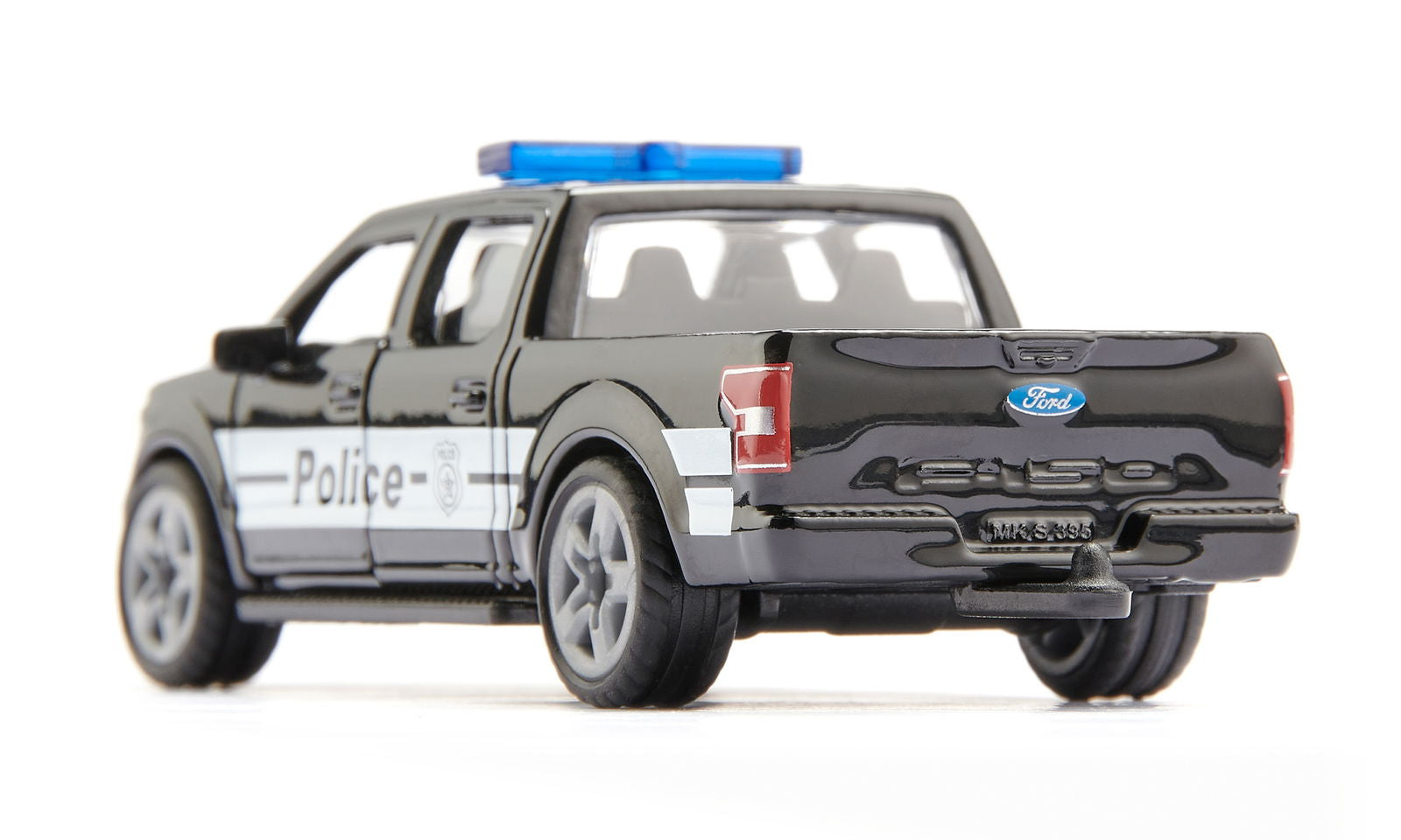 Black die-cast Siku Ford F-150 US police truck toy with a blue light bar, viewed from the rear