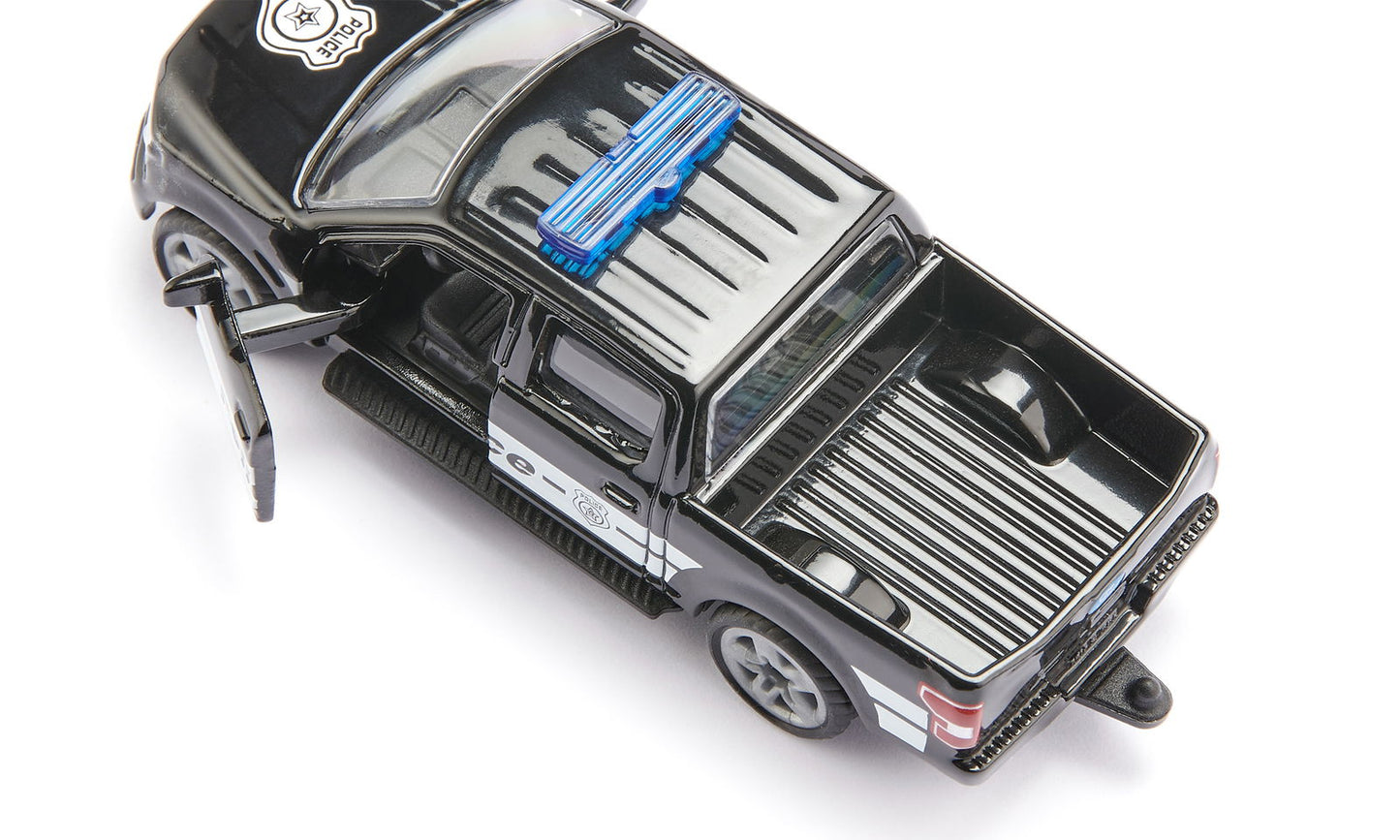 Black toy Siku Ford F-150 US police truck model with blue light bar and open driver's door