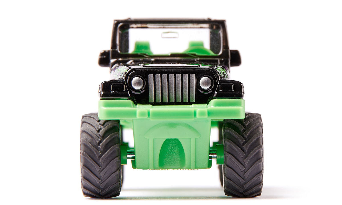 Black and bright green toy Jeep Big Wheel with large tires, front view on white