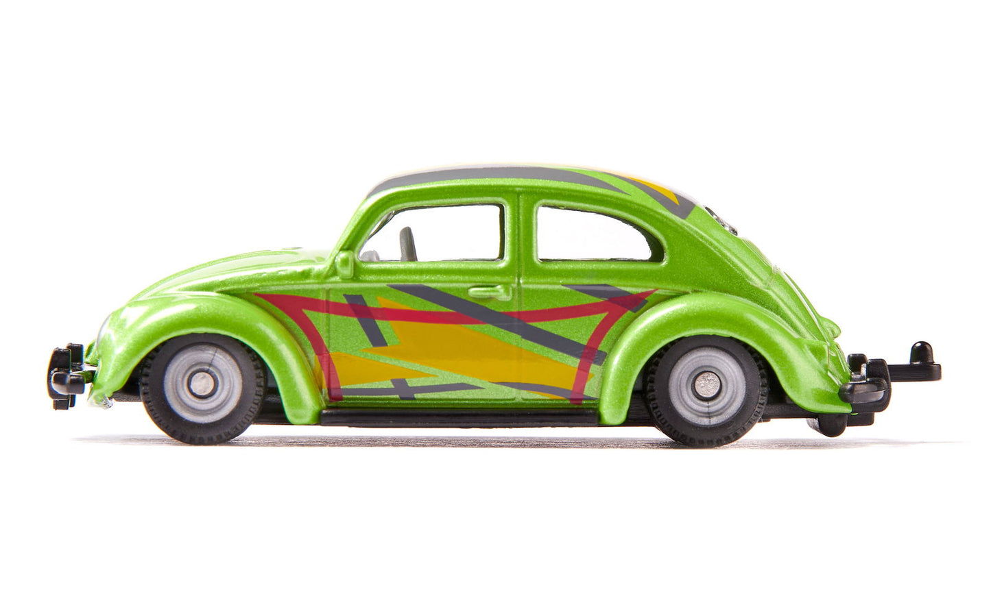 Side view of a lime green Siku Vw Beetle Custom toy car with abstract yellow, red, and gray graphic decals