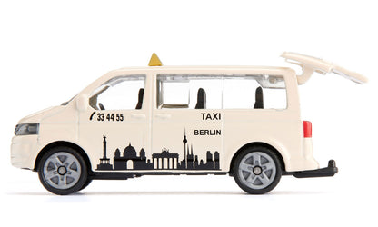 Die-cast beige Siku VW T5 Berlin taxi van model with skyline decals and open rear hatch