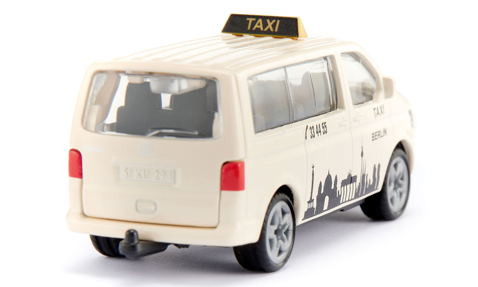 Die-cast beige Siku VW T5 taxi van model with a rooftop sign, "Berlin" text, and a city skyline graphic on the side