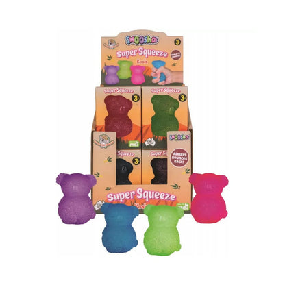 A retail display of "Smooshos Super Squeeze Koala" toys. Several colorful koala-shaped stress toys are shown in a stand and loose