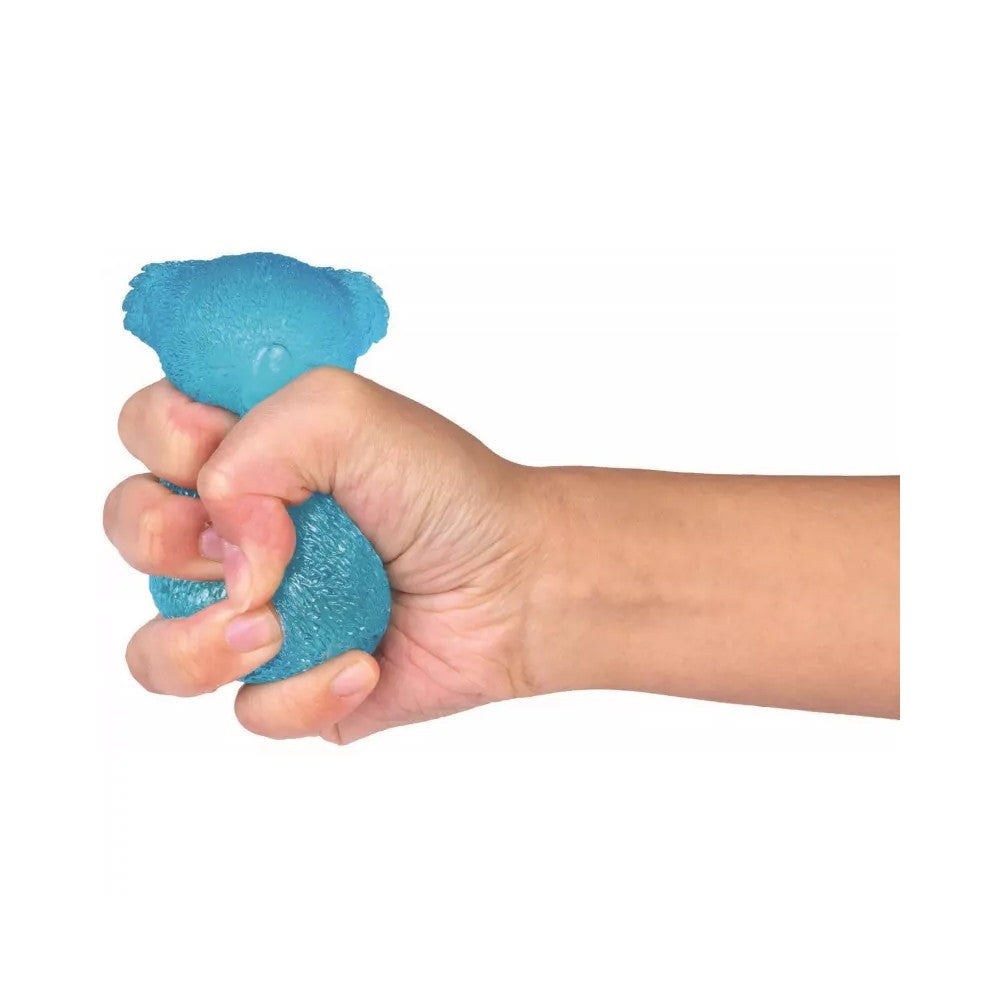 A hand firmly squeezes a translucent blue stress ball