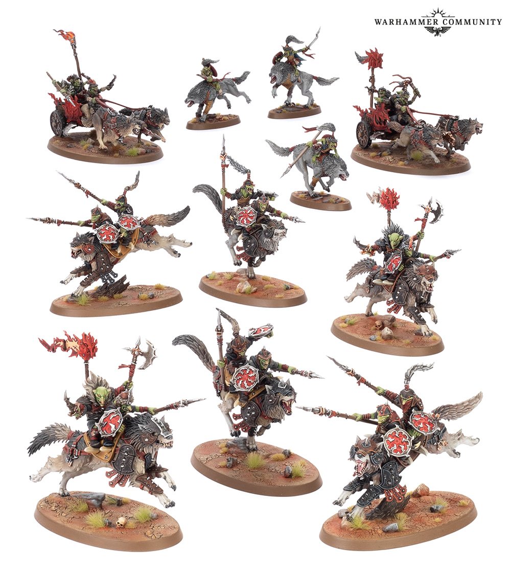 A host of painted Warhammer miniatures: Orruk wolf riders, cavalry, and wolf-drawn chariots