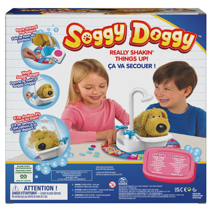 Soggy Doggy board game box showing two children playing with a yellow toy dog in a bathtub on a game board, with gameplay visuals