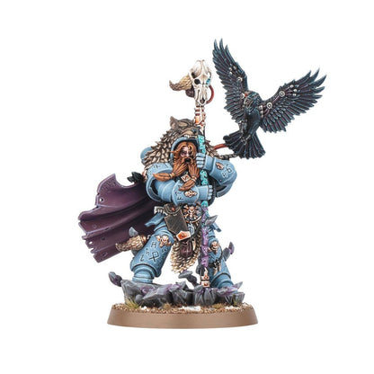 Bearded Space Wolf warrior miniature in blue armor, wolf pelt, holding a skull staff, with a raven flying alongside