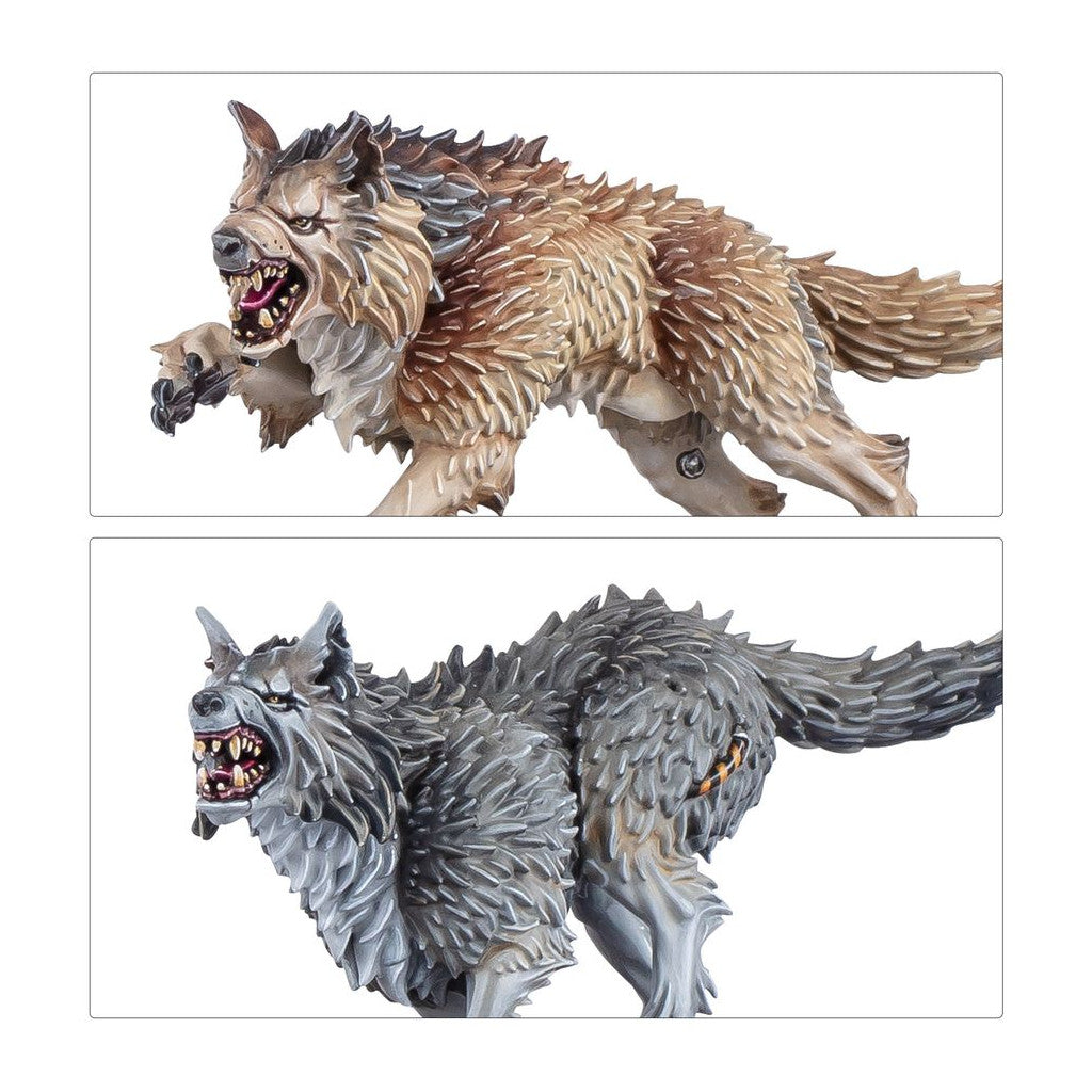 Brown and grey wolf miniatures snarling, teeth bared, in a dynamic leaping pose