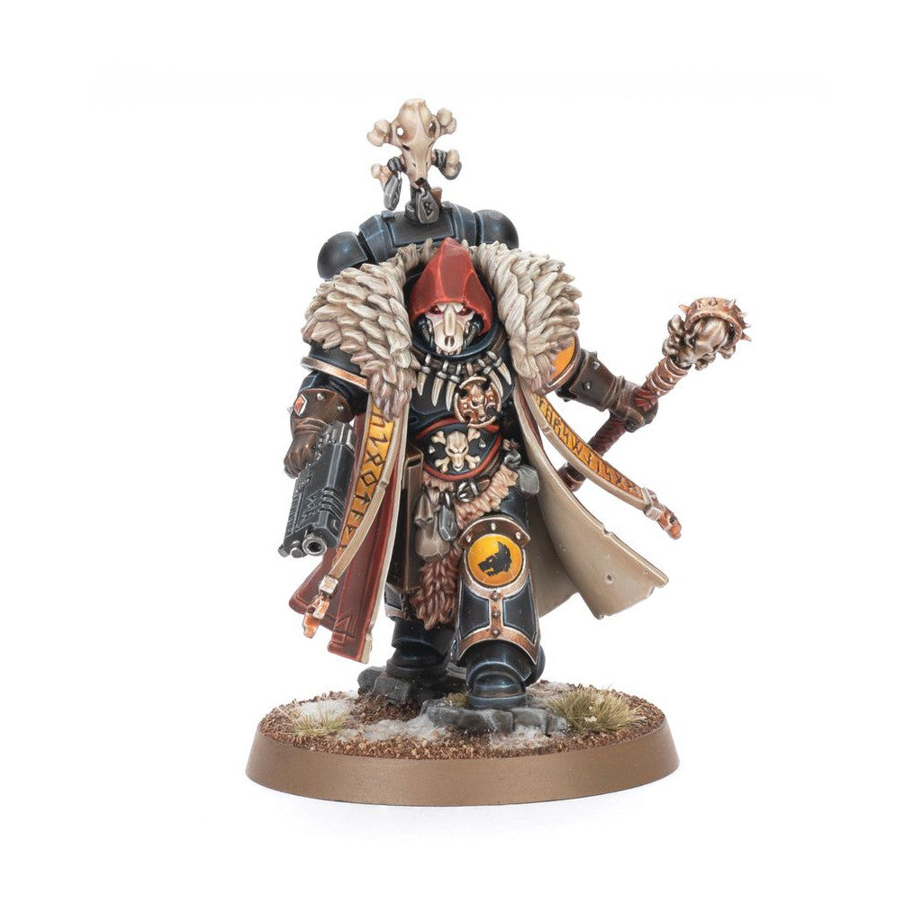 Painted Warhammer 40k Space Wolf miniature in dark armor, fur, red hood, skull mask, holding a pistol and mace