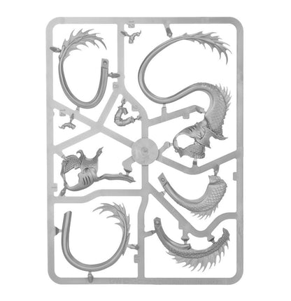 Gray plastic sprue with unassembled fantasy miniature parts for a dragon or serpent, showing a scaled body, wings, and curved tail