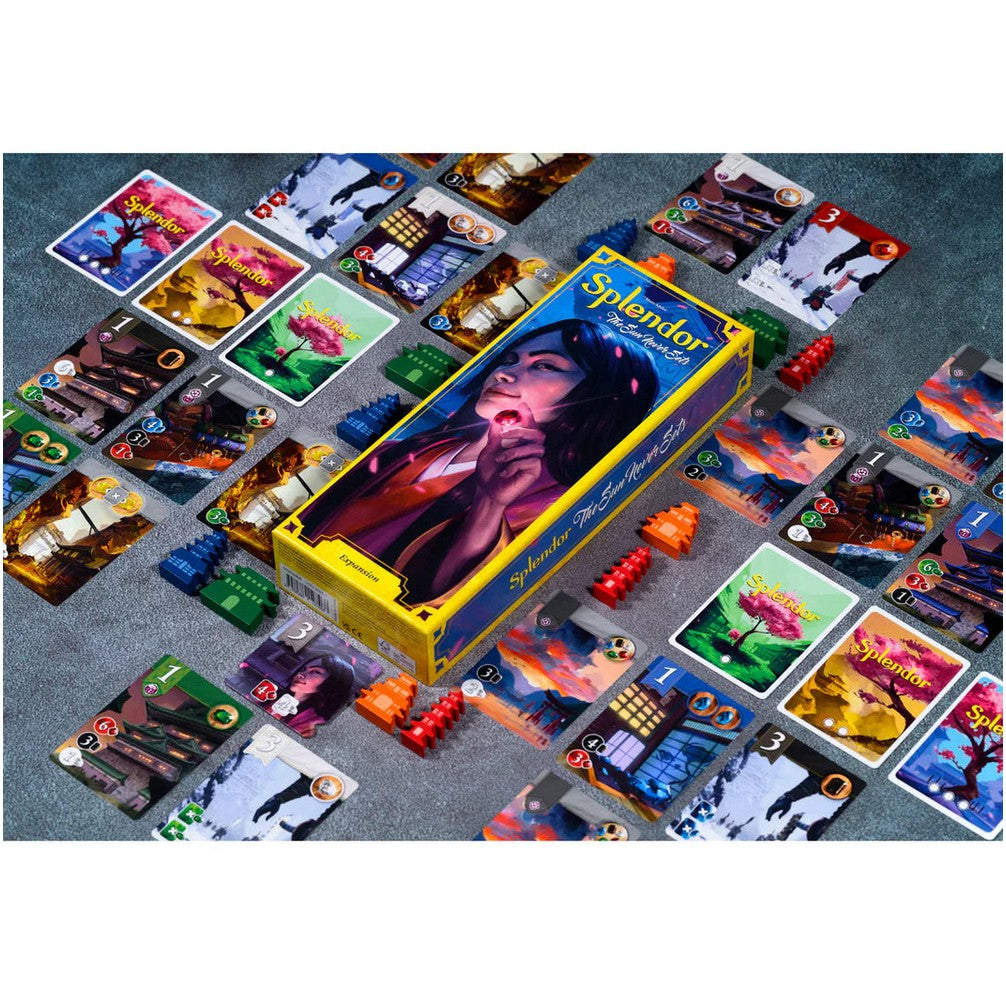 The Splendor: The Sun Never Sets board game box surrounded by numerous colourful game cards and pagoda tokens