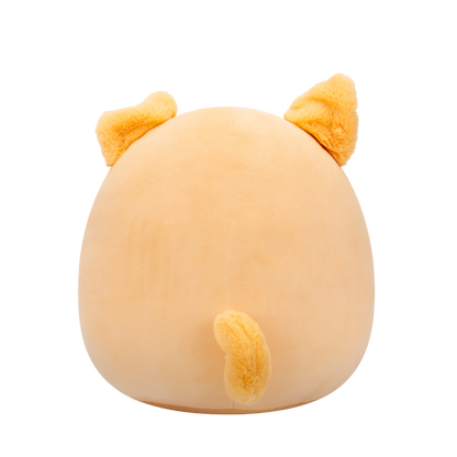 Back view of peach-colored Squishmallow Shiba Inu plush toy with black eyes, white muzzle, embroidered smile, and fuzzy orange ears