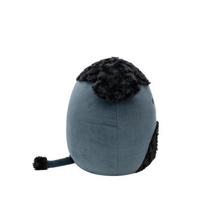 Side view of dark blue-grey Squishmallow bear plush with shaggy black fur on its head and chest, black round eyes, and a white snout with a black nose