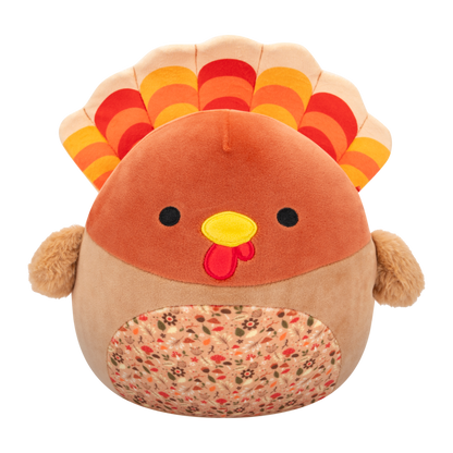 Soft brown turkey plush toy with red, orange, yellow tail feathers, black eyes, yellow beak, and an autumn-patterned belly