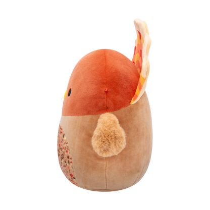 Side veiw of soft brown turkey plush toy with red, orange, yellow tail feathers, black eyes, yellow beak, and an autumn-patterned belly