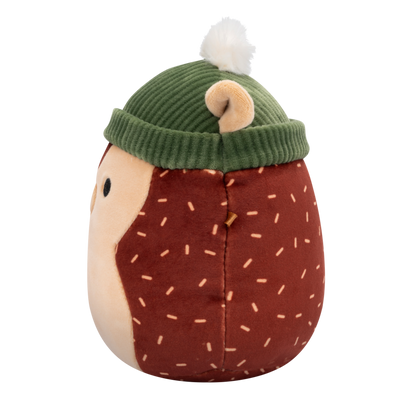 Side view of Squishmallow hedgehog plush toy with a brown body, tan face, and light brown dash patterns, wearing a green ribbed beanie with a white pom-pom