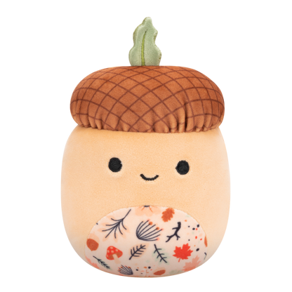 Plush toy with a textured brown cap, green leaf stem, friendly face, and a belly patterned with colorful autumn leaves and mushrooms