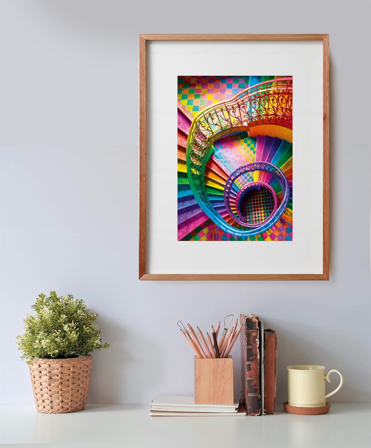 A framed picture of a vibrant, rainbow-colored spiral staircase with an ornate railing, viewed from above.