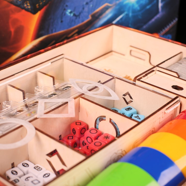 Laserox Inserts for Roll for the Galaxy, capturing close detail of organized game components