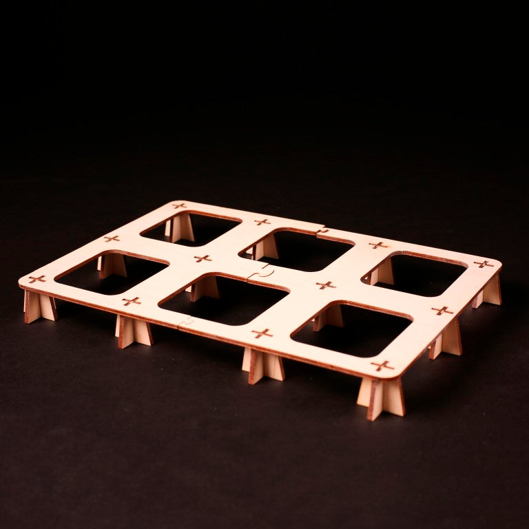 Hands organizing Terra Mystica components into Laserox wooden insert