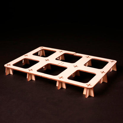 Hands organizing Terra Mystica components into Laserox wooden insert