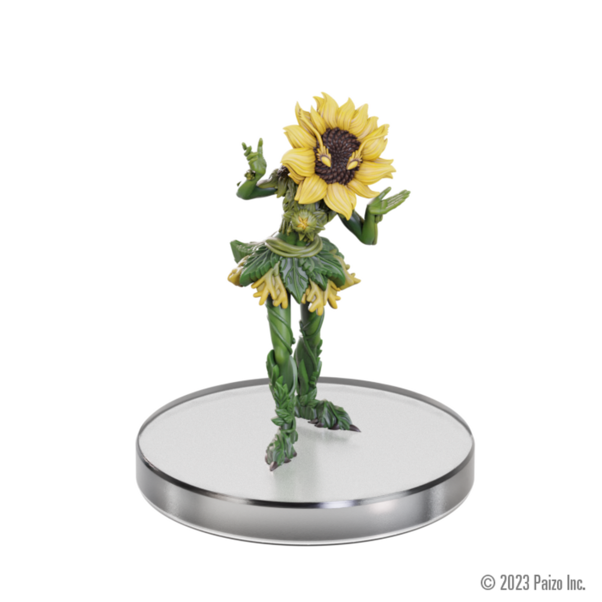 A leafy green figure with a sunflower head stands on a clear base, one hand shows a peace sign, the other open