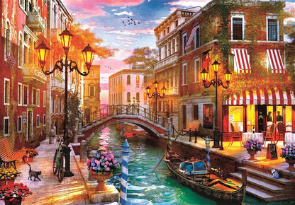 Vibrant painting of a Venetian canal at sunset, with gondola, arched bridge, glowing streetlights, colorful buildings, and cats