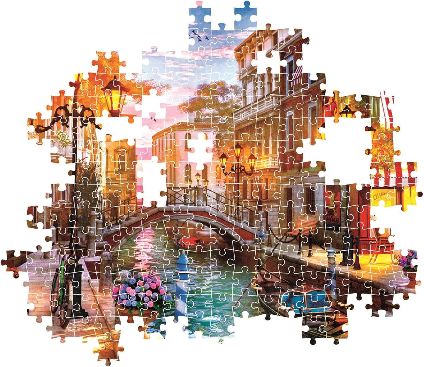 Partially completed jigsaw puzzle showing a Venetian canal scene at sunset with a bridge
